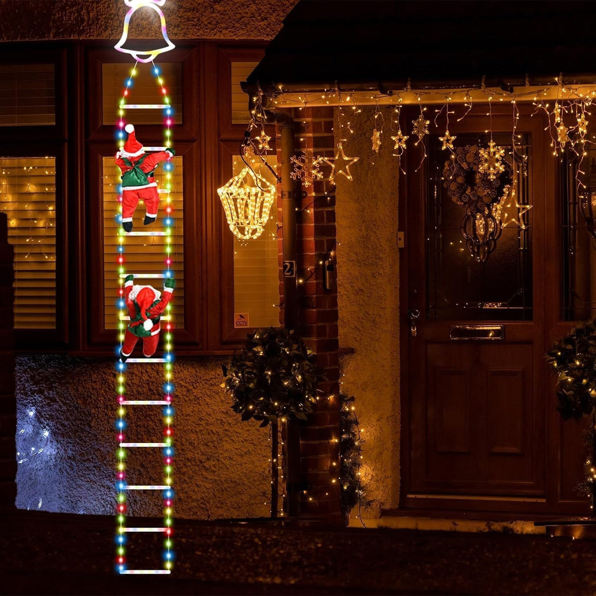 Geanimeerde kerstverlichting op ladder met klimmende Kerstman en afstandsbediening