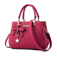 Dames crossbodytas met bloemenhanger