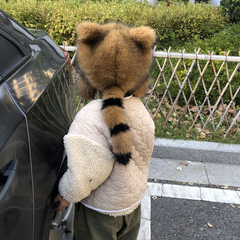 Warme wintermuts van imitatiebont met pompons