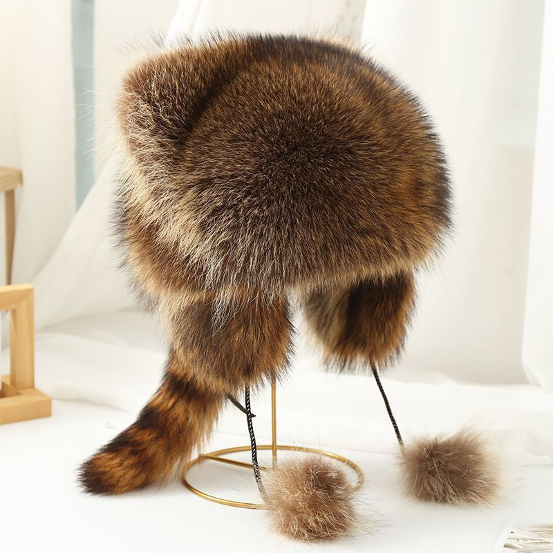 Warme wintermuts van imitatiebont met pompons